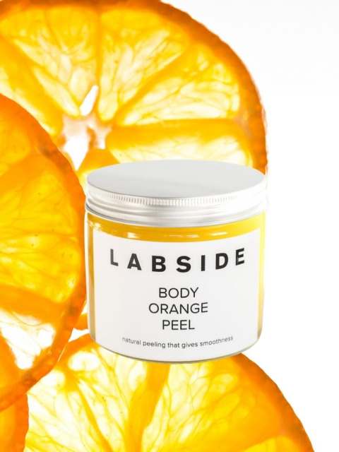 Labside – Body Orange Peel, słoik na tle plastrów pomarańczy Labside – Body Orange Peel, słoik na tle plastrów pomarańczy